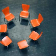 Circle of chairs in group therapy setting