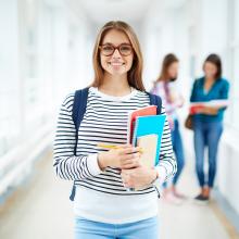 Female student holding folders