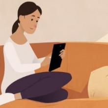 Lady on sofa with tablet device